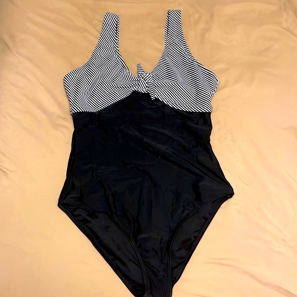Size small navy and white bathing suit. Never been worn!! Very cute!!